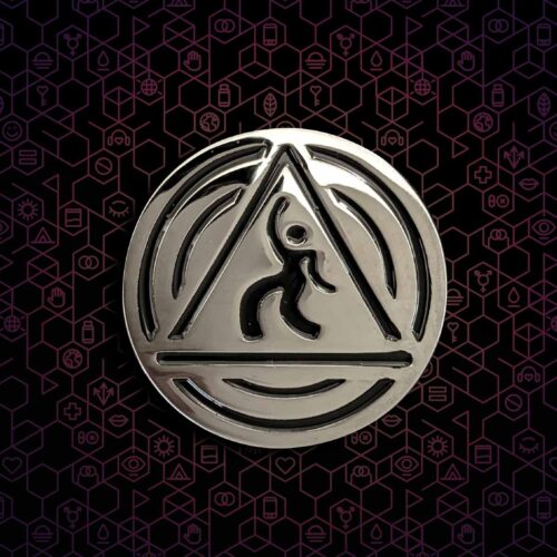 A silver DanceSafe logo pin on a black and hexagonal background.