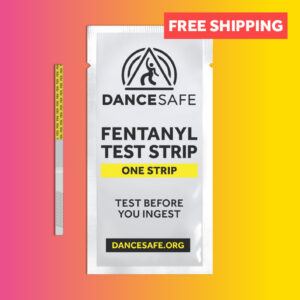 A single fentanyl test strip on a gradient background, next to the pouch it comes in.